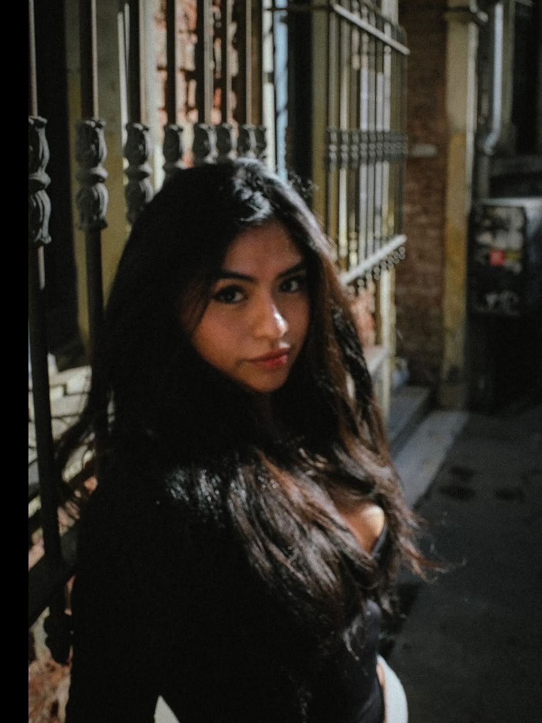 Mara on a city street after dark