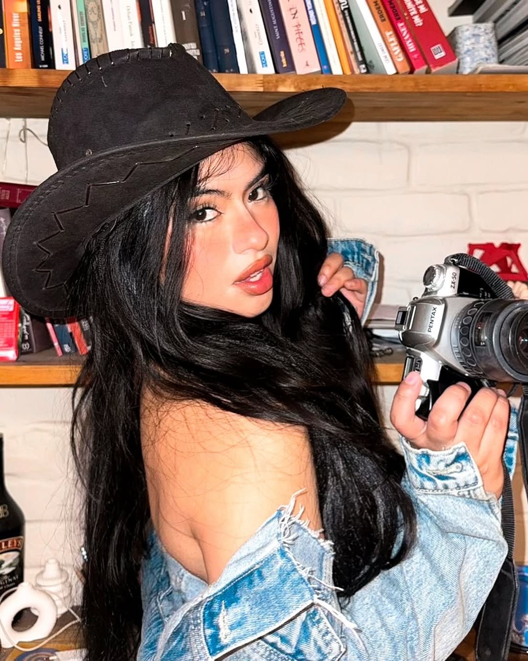 Mara in a denim cowgirl look